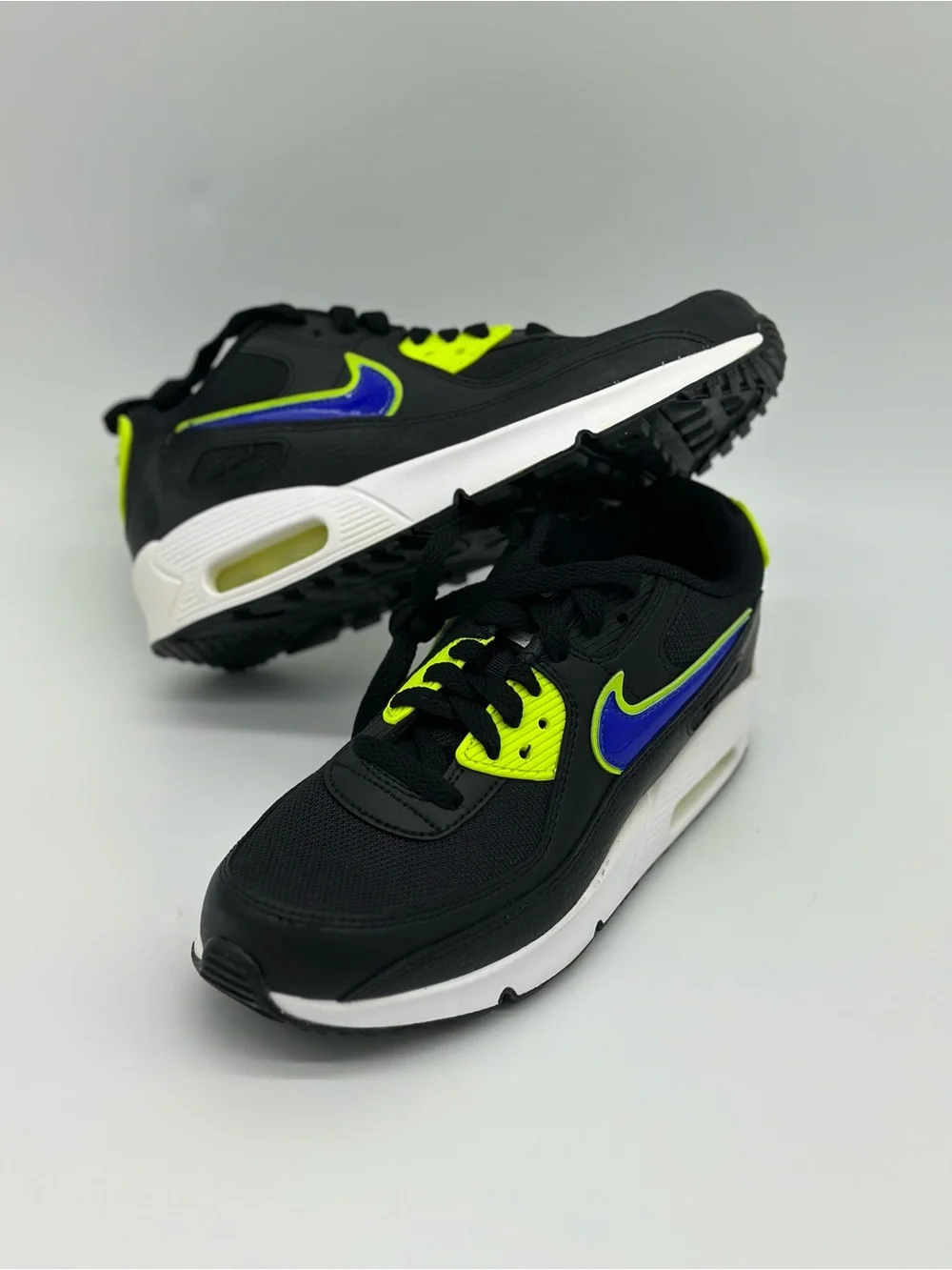 Nike Kids Black Sneakers with Neon Yellow and Blue Swoosh